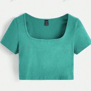 This shirt is a green, long-sleeved, ribbed crop top from SHEIN.